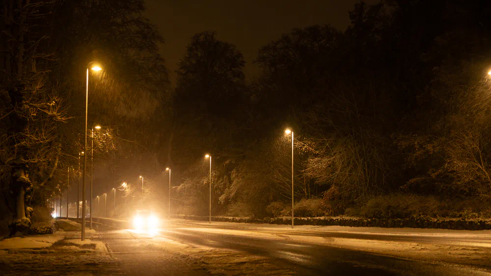 snowy street at night